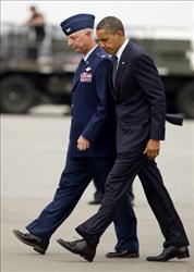 President Obama walks with Col. Mark Camerer as he arrives at Dover Air Force Base.