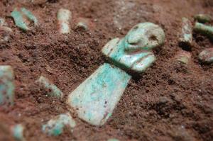 This photo taken on May 25, 2012 shows a jade piece in the tomb of a very early Mayan ruler.